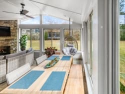 Sun room with patio, and furniture.